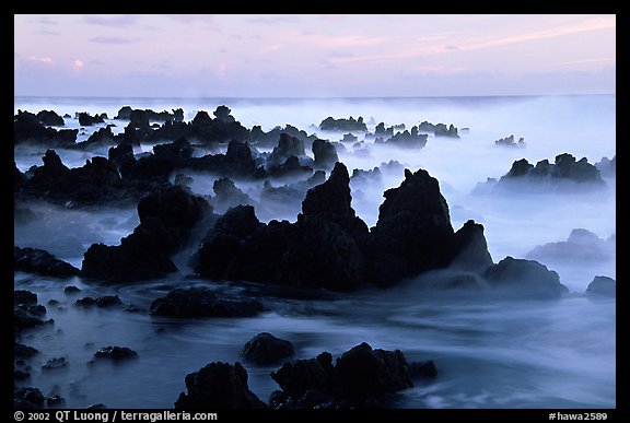 Volcanic rocks and waves at sunrise, Keanae Peninsula. Maui, Hawaii, USA