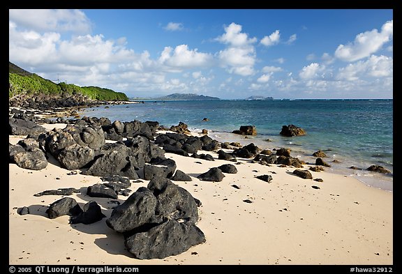 Volcanic rocks and beach, near Makai research pier,  early morning. Oahu island, Hawaii, USA