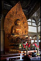 Amida seated on a lotus flower, the largest Buddha statue carved in over 900 years, Byodo-In Temple. Oahu island, Hawaii, USA (color)