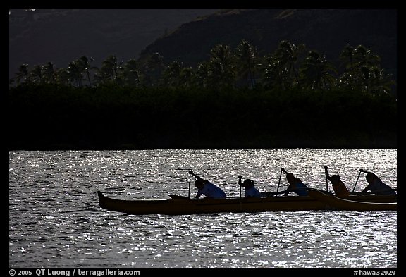 Backlit outrigger canoe, Maunalua Bay, late afternoon. Oahu island, Hawaii, USA (color)