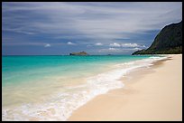 Sand, turquoise waters, and pali, Waimanalo Beach. Oahu island, Hawaii, USA