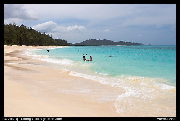 Couple and other bathers in the water, Waimanalo Beach. Oahu island, Hawaii, USA (color)