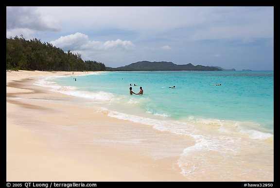 Couple and other bathers in the water, Waimanalo Beach. Oahu island, Hawaii, USA