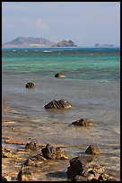 Rocks and turquoise waters near Makai research pier. Oahu island, Hawaii, USA