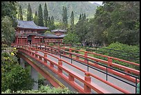 Red bridge leading to Byodo-In Temple. Oahu island, Hawaii, USA