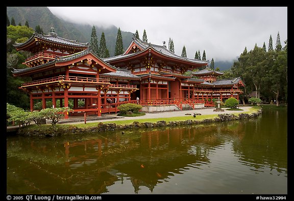 Byodo-In temple reflected in pond on a cloudy day. Oahu island, Hawaii, USA