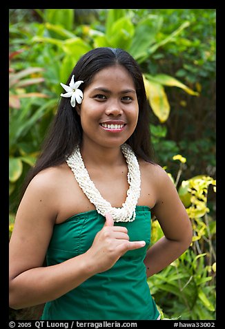 Tahitian woman making the traditional welcome gesture. Polynesian Cultural Center, Oahu island, Hawaii, USA