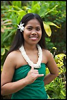 Tahitian woman making the traditional welcome gesture. Polynesian Cultural Center, Oahu island, Hawaii, USA (color)