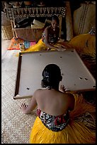 Fiji women playing a traditional game similar to pool. Polynesian Cultural Center, Oahu island, Hawaii, USA (color)