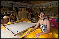 Fiji women sitting at a traditional pool table in vale ni bose (meeting) house. Polynesian Cultural Center, Oahu island, Hawaii, USA (color)