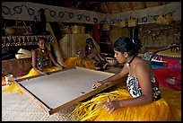 Fiji women playing at a traditional pool table in vale ni bose house. Polynesian Cultural Center, Oahu island, Hawaii, USA (color)