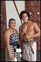 Maori woman and man sticking out his tongue. Polynesian Cultural Center, Oahu island, Hawaii, USA