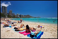 Young women sunning on Waikiki Beach. Waikiki, Honolulu, Oahu island, Hawaii, USA (color)