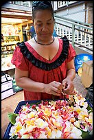 Woman preparing a fresh flower lei, International Marketplace. Waikiki, Honolulu, Oahu island, Hawaii, USA