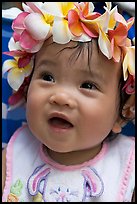 Baby girl wearing a flower lei on her head. Waikiki, Honolulu, Oahu island, Hawaii, USA