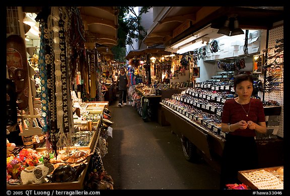 Woman and stands, International Marketplace. Waikiki, Honolulu, Oahu island, Hawaii, USA (color)