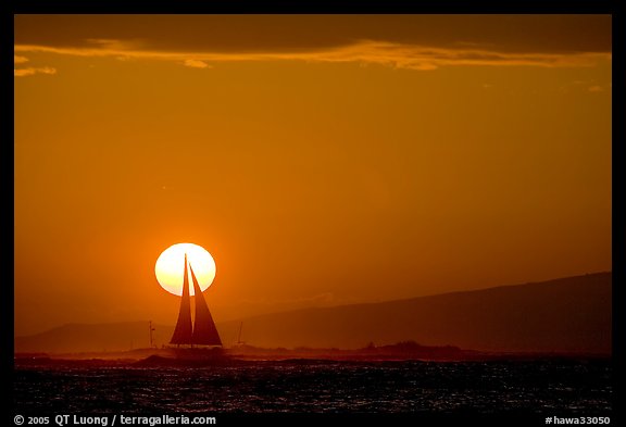 Sailboat and sun disk, sunset. Waikiki, Honolulu, Oahu island, Hawaii, USA (color)