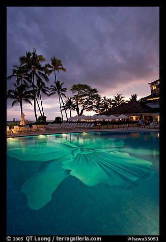 Swimming pool at sunset, Halekulani hotel. Waikiki, Honolulu, Oahu island, Hawaii, USA