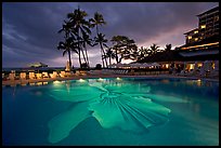 Swimming pool at sunset, Halekulani hotel. Waikiki, Honolulu, Oahu island, Hawaii, USA