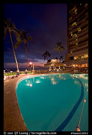 Swimming pool at night, with dance performance, Sheraton hotel. Waikiki, Honolulu, Oahu island, Hawaii, USA