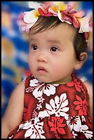 Baby girl in hawaiian dress wearing a flower lei on her head. Waikiki, Honolulu, Oahu island, Hawaii, USA (color)