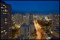 Boulevard and high-rise towers at dusk. Waikiki, Honolulu, Oahu island, Hawaii, USA ( color)