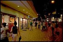 Shops on Kalakaua avenue at night. Waikiki, Honolulu, Oahu island, Hawaii, USA ( color)