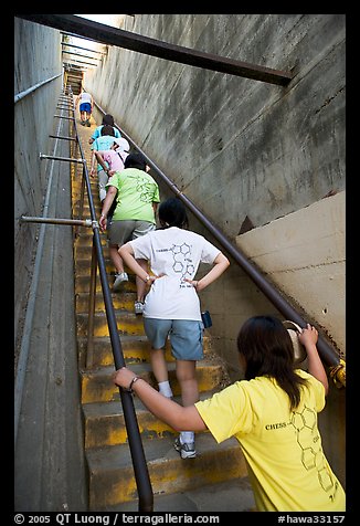 Women climbing a staircase on the Diamond Head summit trail. Oahu island, Hawaii, USA