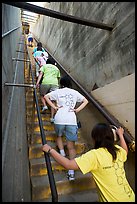 Women climbing a staircase on the Diamond Head summit trail. Oahu island, Hawaii, USA (color)