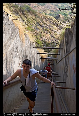 Tourist climbing a staircase on the Diamond Head summit trail. Oahu island, Hawaii, USA