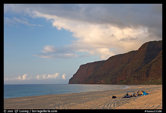 Campers and tire tracks in the sand, Polihale Beach, sunset. Kauai island, Hawaii, USA