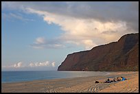 Campers and tire tracks in the sand, Polihale Beach, sunset. Kauai island, Hawaii, USA