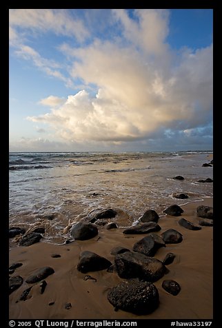 Boulders, beach and clouds, Lydgate Park, sunrise. Kauai island, Hawaii, USA