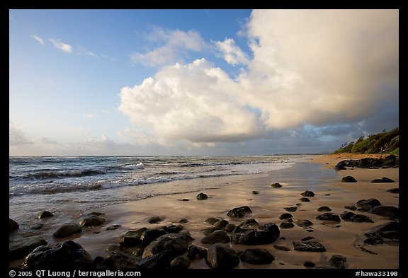 Boulders, beach and clouds, Lydgate Park, sunrise. Kauai island, Hawaii, USA (color)