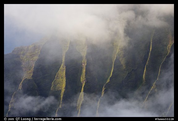 Fluted ridges seen through mist, Kalalau lookout, late afternoon. Kauai island, Hawaii, USA