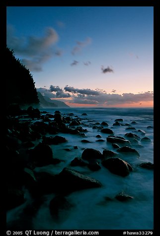 Boulders and misty surf from Kee Beach, dusk. Kauai island, Hawaii, USA