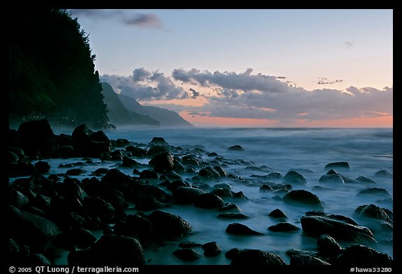 Boulders, surf, and Na Pali Coast, Kee Beach, dusk. Kauai island, Hawaii, USA (color)