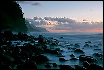 Boulders, surf, and Na Pali Coast, Kee Beach, dusk. Kauai island, Hawaii, USA