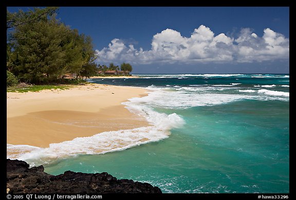 Beach and  turquoise waters, and homes  near Haena. North shore, Kauai island, Hawaii, USA (color)