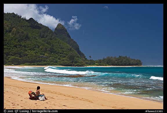 Woman sitting on a beach chair on Makua (Tunnels) Beach. North shore, Kauai island, Hawaii, USA