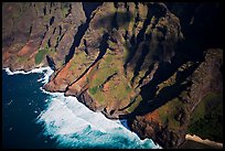 Aerial view of fluted mountains and surf, Na Pali Coast. Kauai island, Hawaii, USA