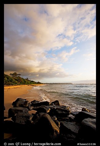 Boulders and beach, Lydgate Park, sunrise. Kauai island, Hawaii, USA