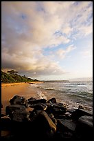 Boulders and beach, Lydgate Park, sunrise. Kauai island, Hawaii, USA (color)