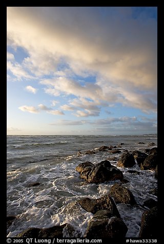 Boulders and ocean, Lydgate Park, sunrise. Kauai island, Hawaii, USA (color)