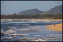 Woman with child on beach, Lydgate Park, early morning. Kauai island, Hawaii, USA ( color)