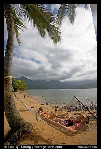 Family on Hammock, Puu Poa Beach. Kauai island, Hawaii, USA (color)