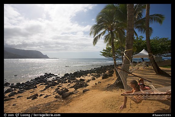 Family on Hammock, Puu Poa Beach. Kauai island, Hawaii, USA