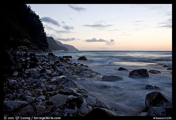 Boulders, waves, and Na Pali Coast, sunset. North shore, Kauai island, Hawaii, USA (color)