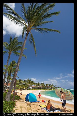 Couple and tent, Sheraton Beach, mid-day. Kauai island, Hawaii, USA