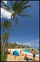 Couple and tent, Sheraton Beach, mid-day. Kauai island, Hawaii, USA